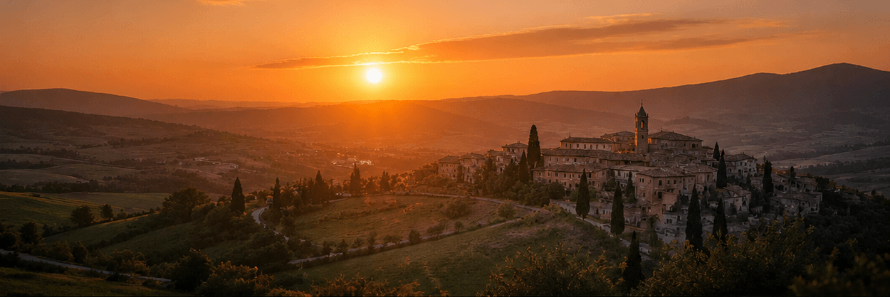 Mesma paisagem toscana com lente 50mm: enquadramento natural, vilarejo com mais presença