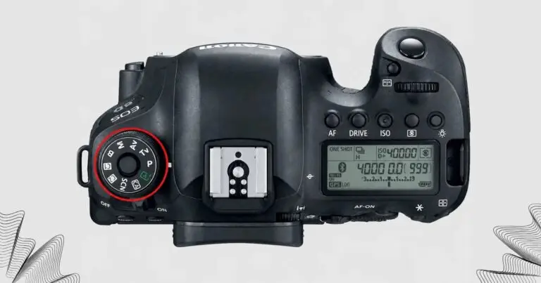 Seletor de modos de exposição no topo de uma câmera DSLR